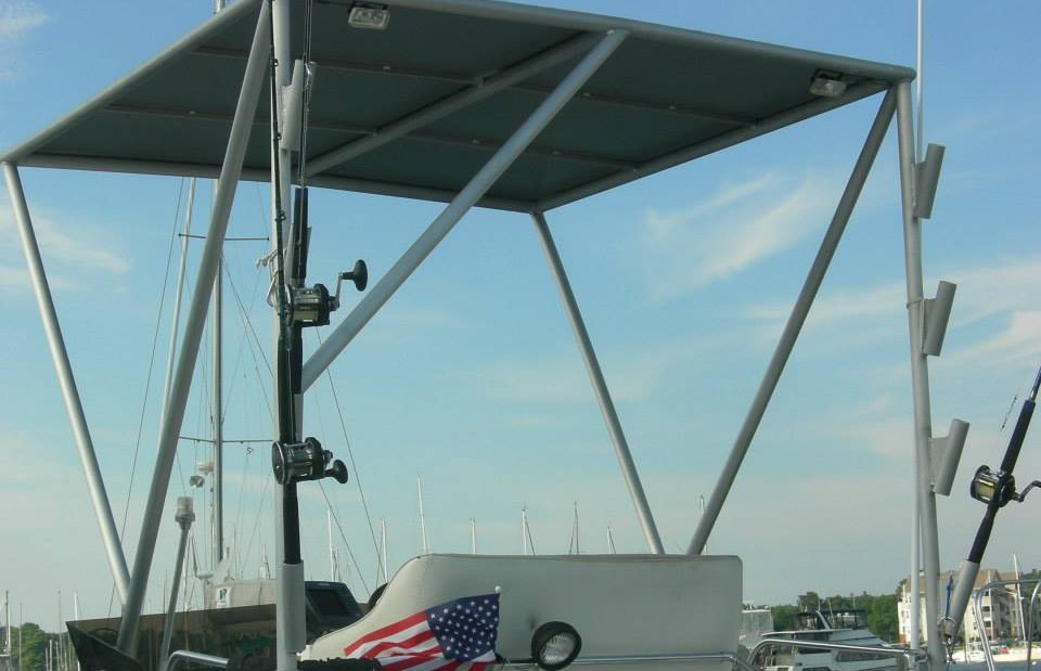 Marine canopy frame with integrated rod holder work